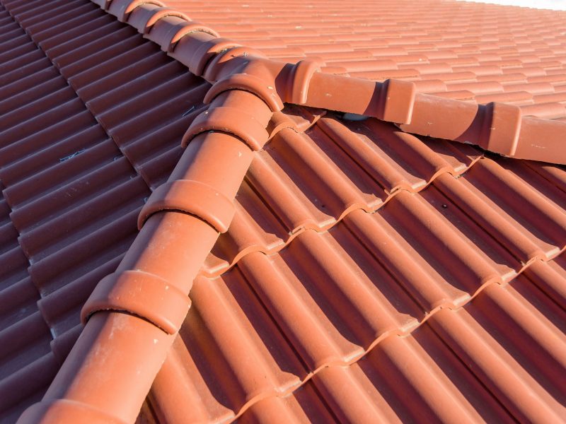 The roof of a high-rise building. Roof made of clay tiles. Environmentally friendly tiles. Roofing material